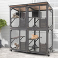 Large grey wooden outdoor catio cat enclosure on wheels with asphalt roof