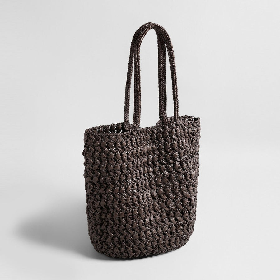 Chocolate handwoven raffia basket tote, angled view